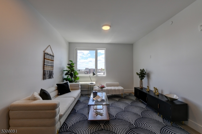 39 Madison Street Newark, NJ 07105 - Photo 8 of 33 a living room with furniture and a window