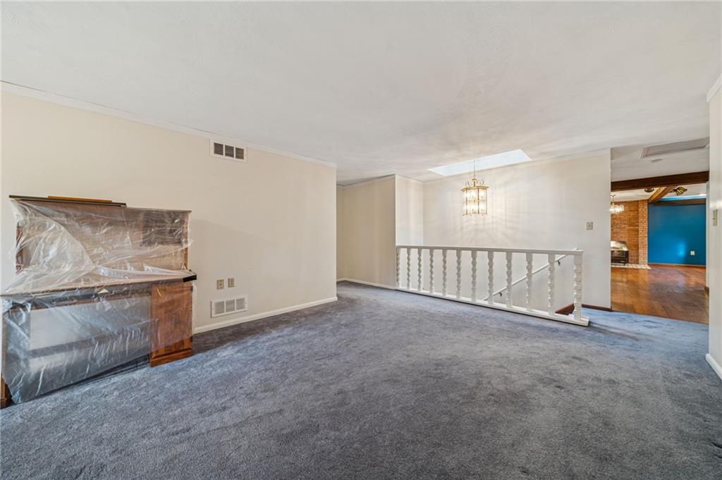 12219 Roth Drive Irwin, PA 15642 - Photo 19 of 49 a view of a livingroom with an empty space and a fireplace