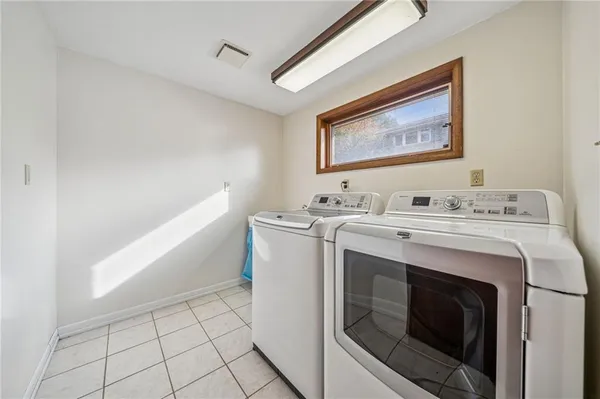 a utility room with washer and dryer