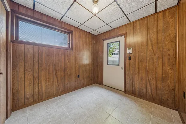 a view of an empty room with wooden door