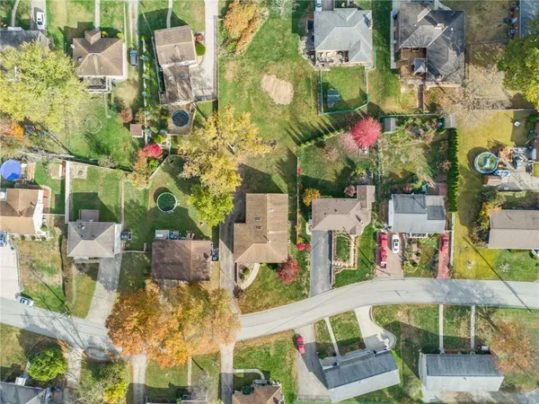 an aerial view of residential building with parking space
