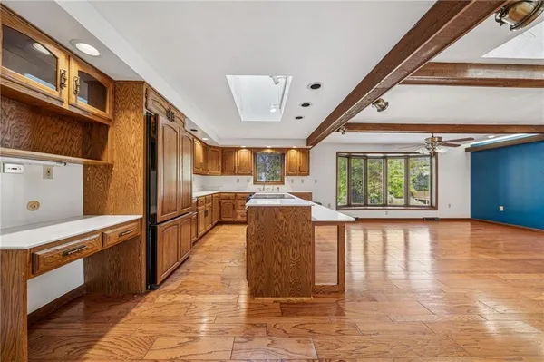 a view of a kitchen with furniture and a window