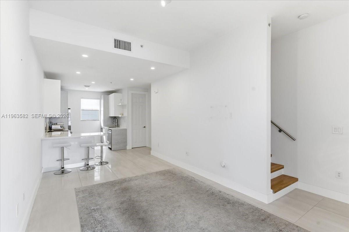 a living room with furniture and a table
