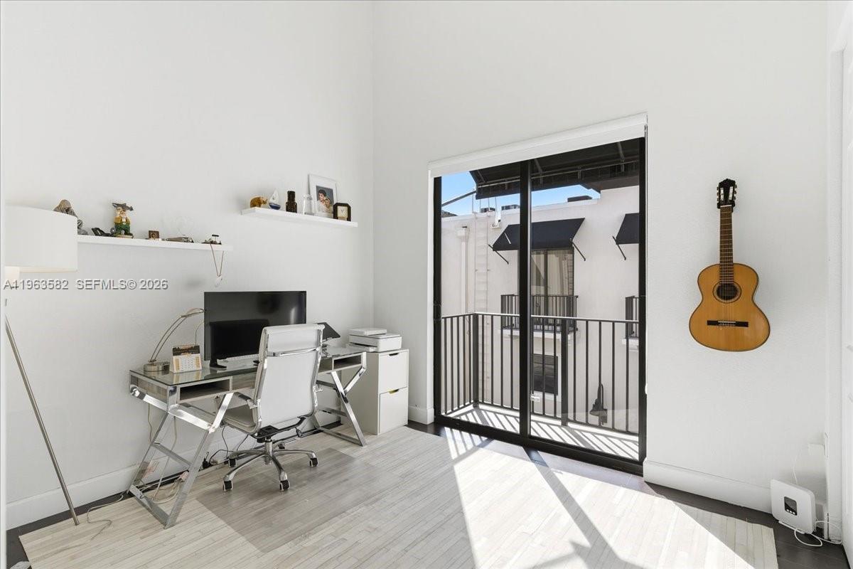 7743 Southwest 99th Street, Unit 2 Miami, FL 33156 - Photo 12 of 40 a view of workspace with wooden floor