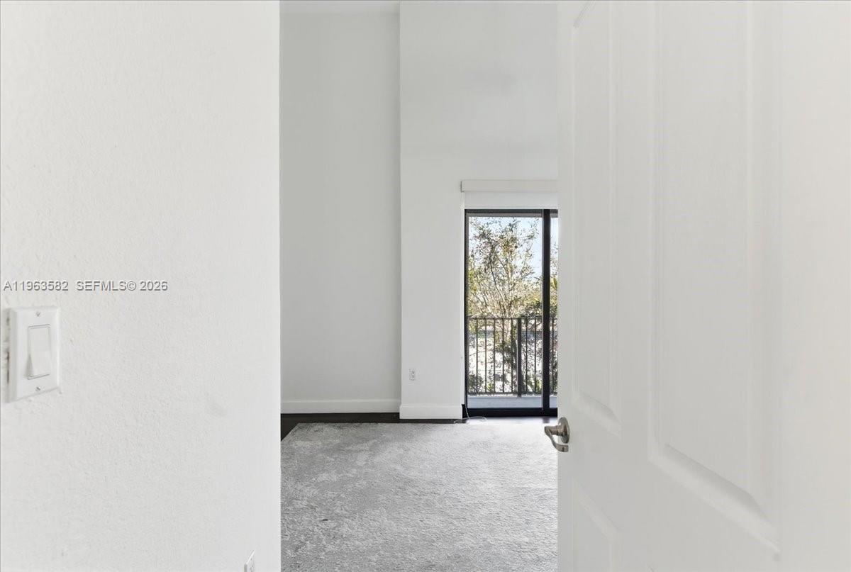 7743 Southwest 99th Street, Unit 2 Miami, FL 33156 - Photo 18 of 40 an empty room with windows