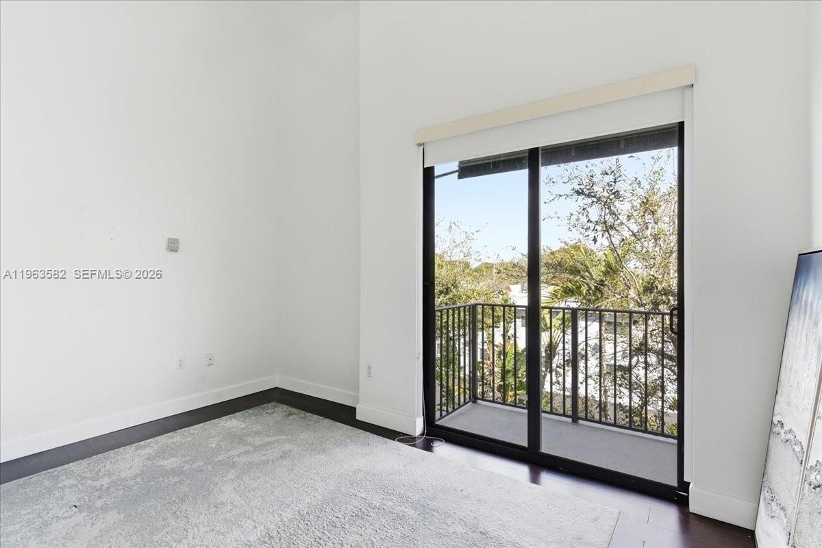 7743 Southwest 99th Street, Unit 2 Miami, FL 33156 - Photo 21 of 40 a view of a room with sliding door