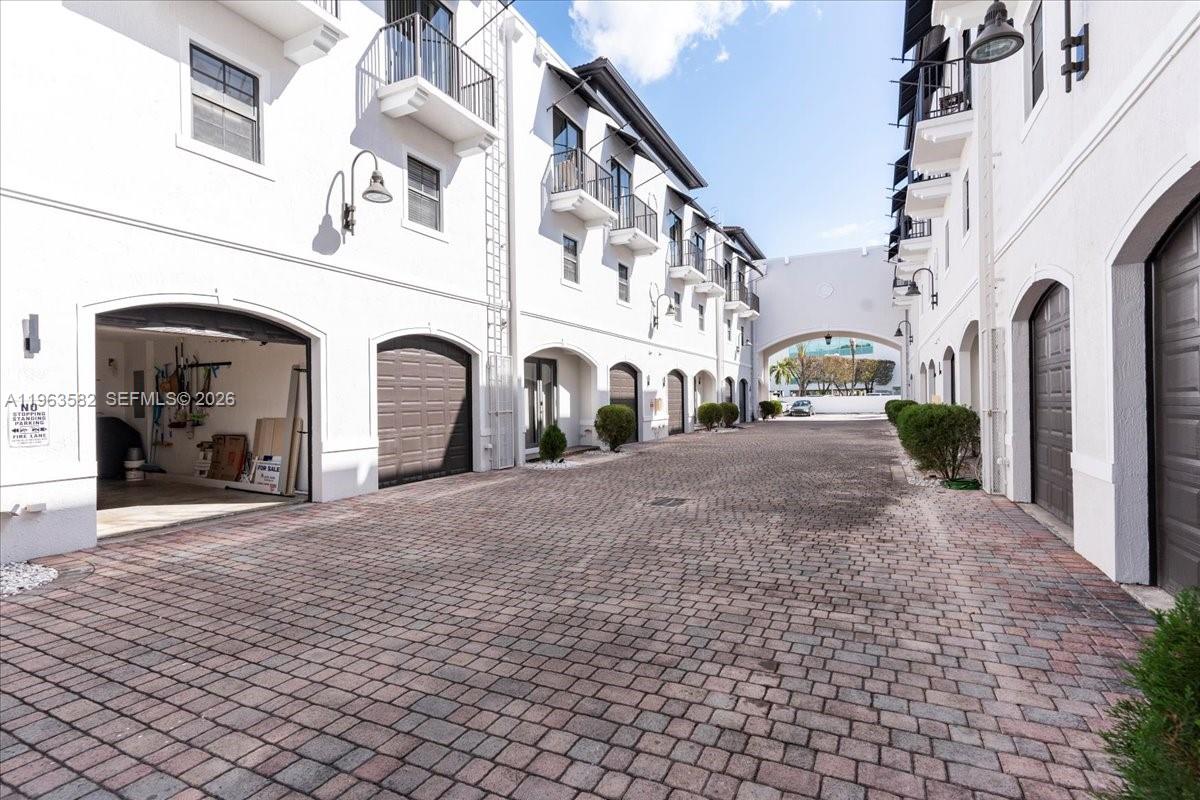 7743 Southwest 99th Street, Unit 2 Miami, FL 33156 - Photo 27 of 40 a view of a building with a street