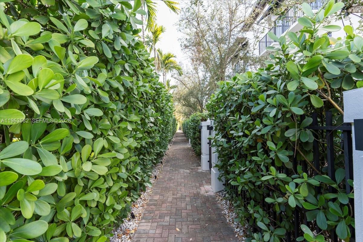 7743 Southwest 99th Street, Unit 2 Miami, FL 33156 - Photo 30 of 40 a view of a pathway in a garden