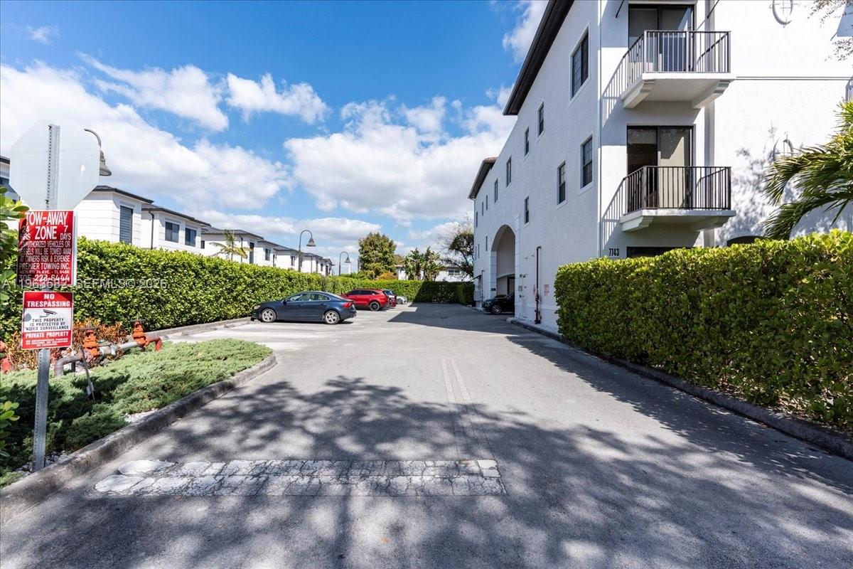 7743 Southwest 99th Street, Unit 2 Miami, FL 33156 - Photo 32 of 40 a view of street with parked cars
