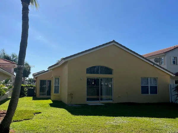 a house view with a garden space