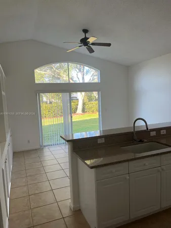 a kitchen with a sink and a window