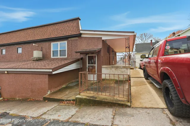 a front view of a house with a garage