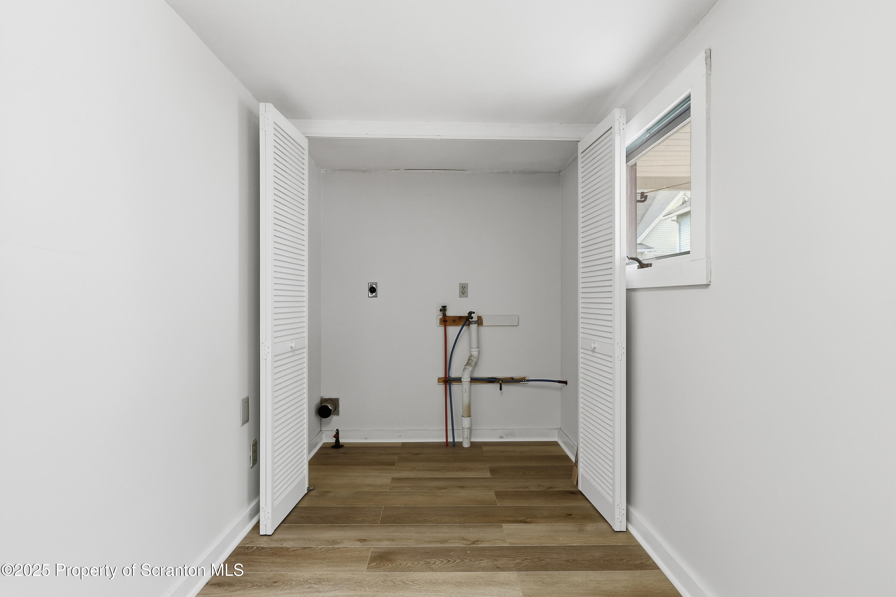 2521 North Main Avenue Scranton, PA 18508 - Photo 3 of 16 a view of a hallway view with wooden floor and staircase