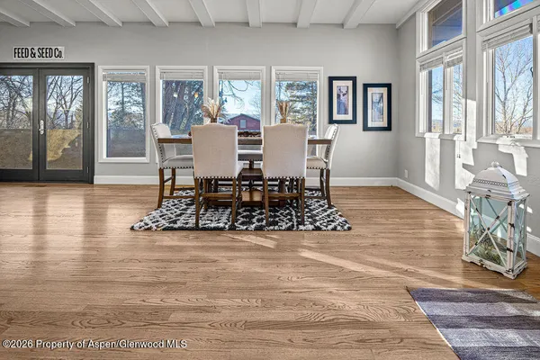 a living room with furniture rug and window