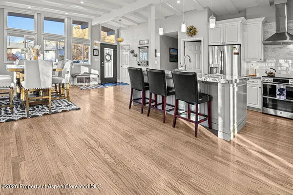 a view of a kitchen and dining room