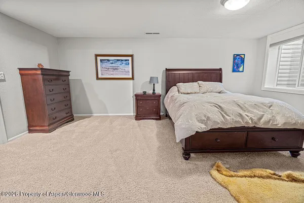 a bedroom with furniture and a bed