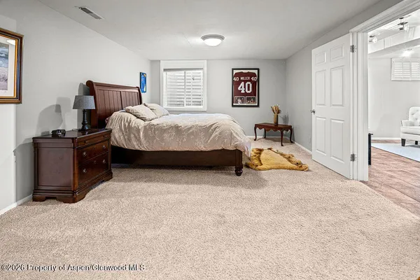 a bathroom with a sink a mirror and shower
