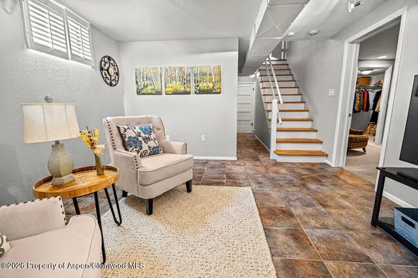 a living room with furniture and a table
