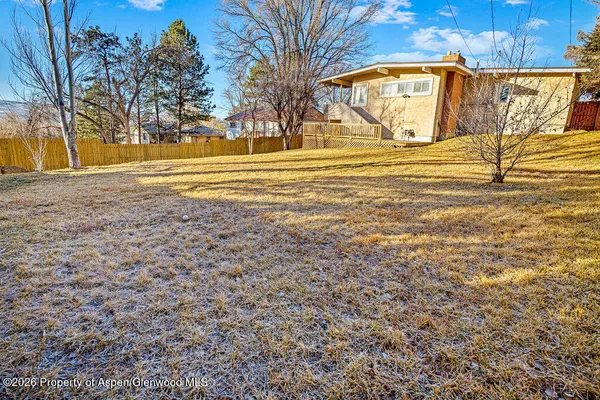 a view of a yard with an outdoor space