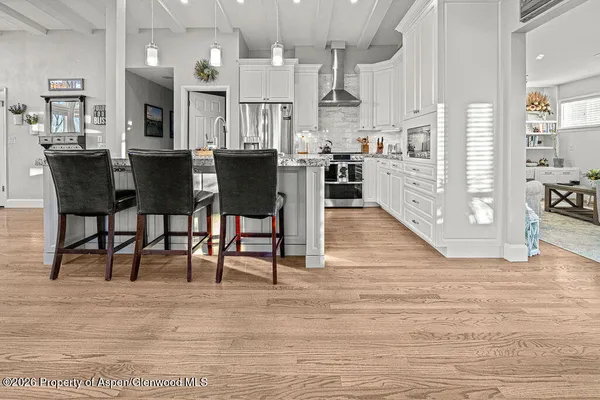 a view of kitchen with cabinets and wooden floor