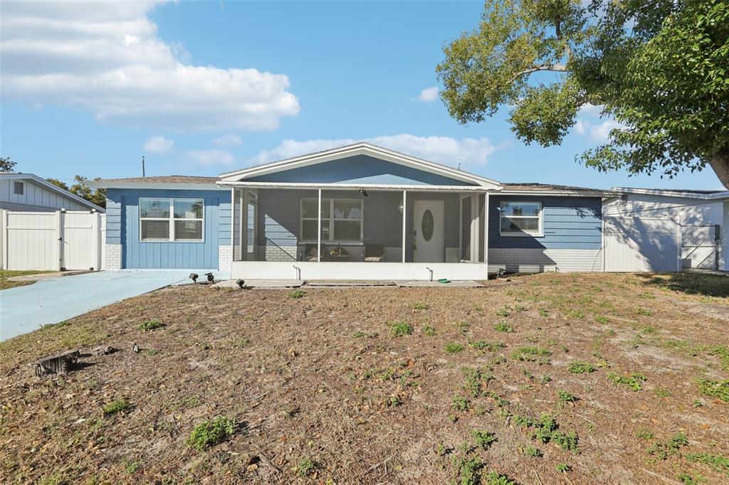 4703 Manor Drive New Port Richey, FL 34652 - Photo 1 of 1 front view of a house with a yard