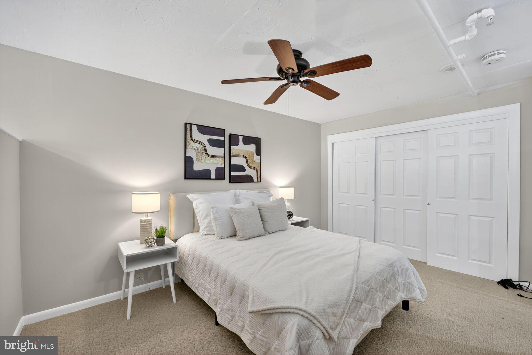 811 4th Street Northwest, Unit 807 Washington, DC 20001 - Photo 12 of 32 a bedroom with a bed and painting on the wall