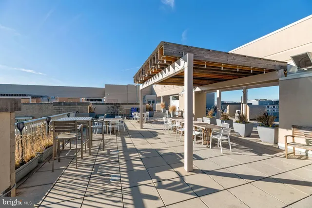 a view of a swimming pool with chairs