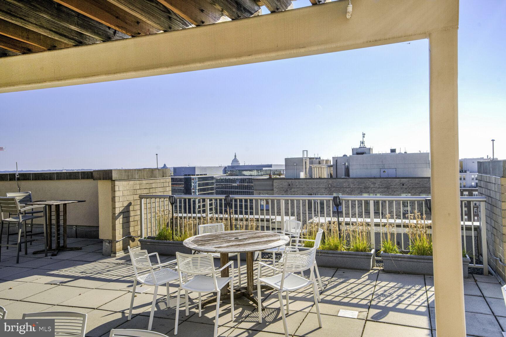 811 4th Street Northwest, Unit 807 Washington, DC 20001 - Photo 19 of 32 a view of a balcony with chairs
