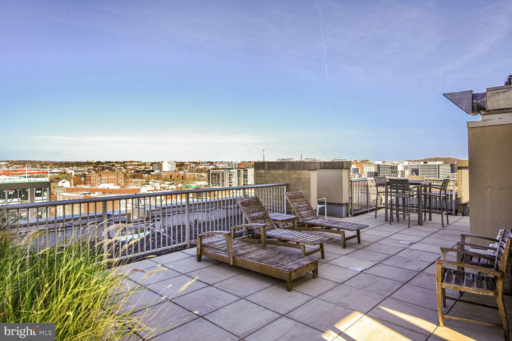 811 4th Street Northwest, Unit 807 Washington, DC 20001 - Photo 20 of 32 a view of a terrace with lawn chairs
