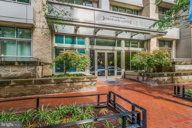 front view of a house with a yard balcony