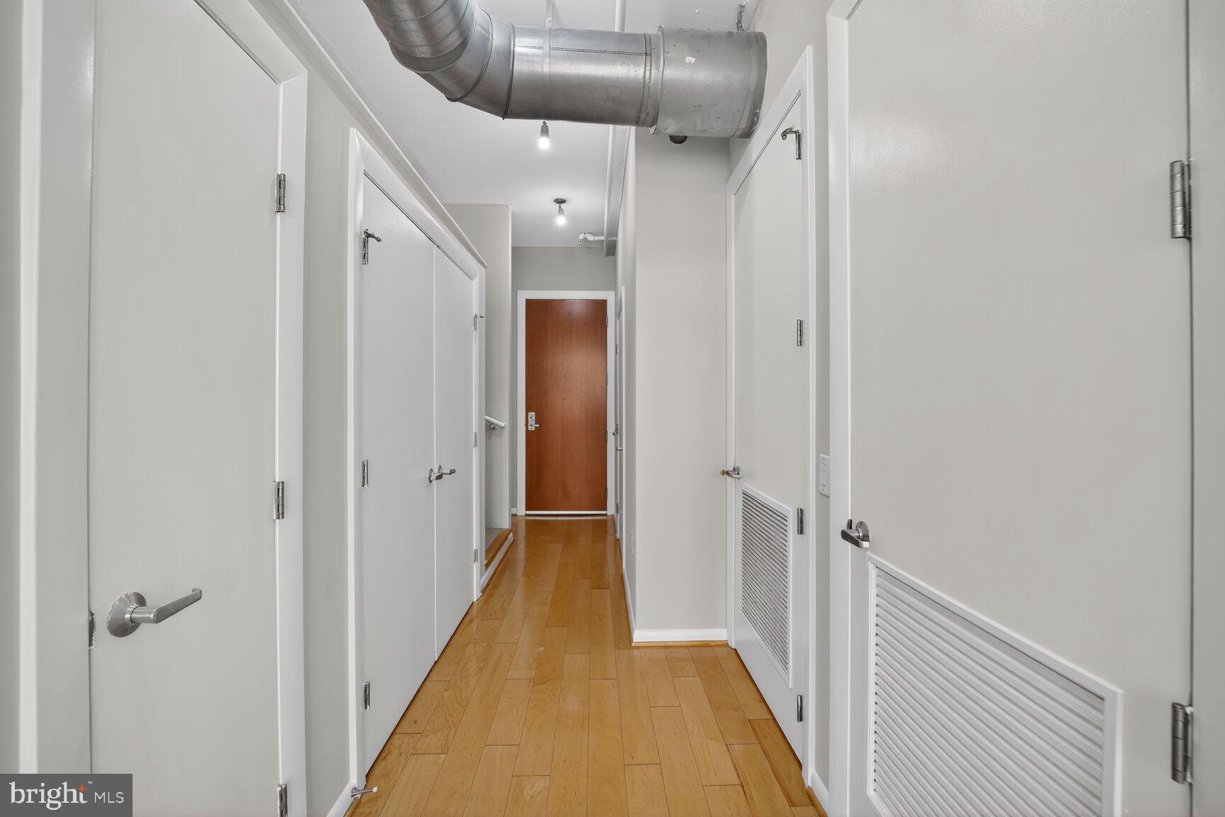 811 4th Street Northwest, Unit 807 Washington, DC 20001 - Photo 32 of 32 a view of a hallway with wooden floor and a hallway