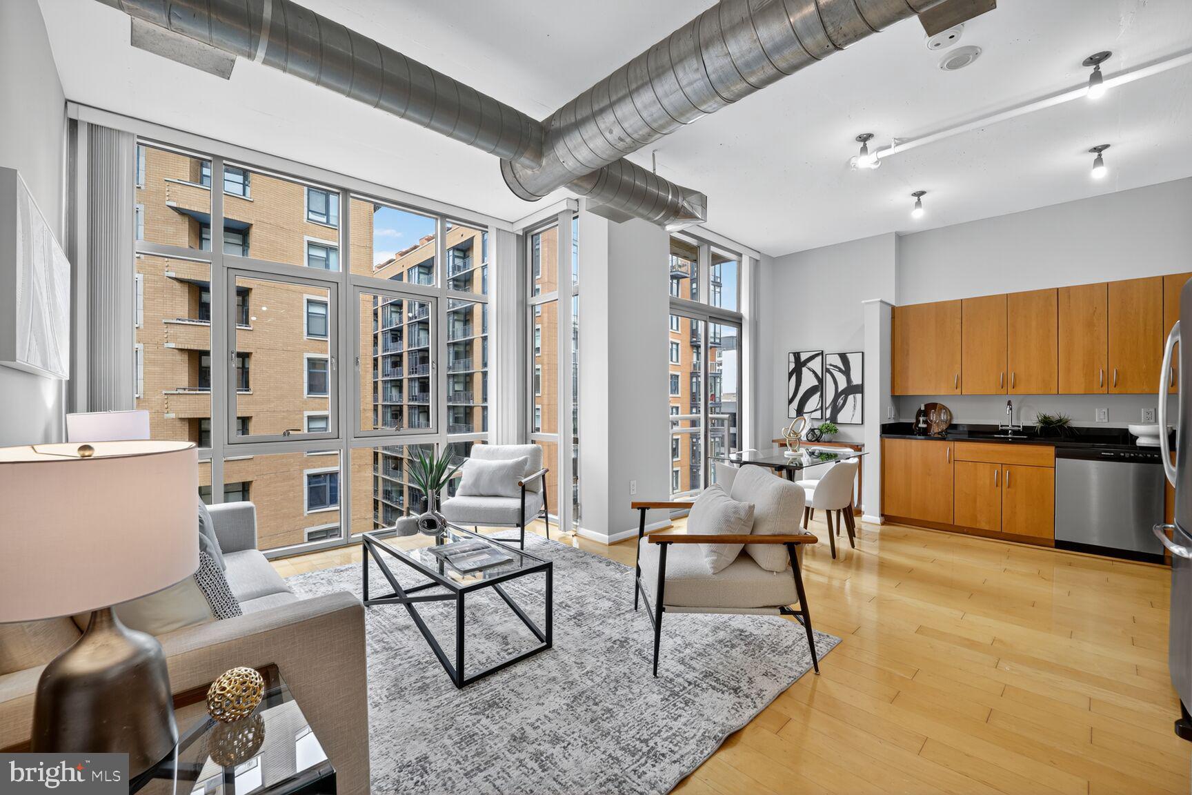 811 4th Street Northwest, Unit 807 Washington, DC 20001 - Photo 4 of 32 a living room with furniture and view of kitchen