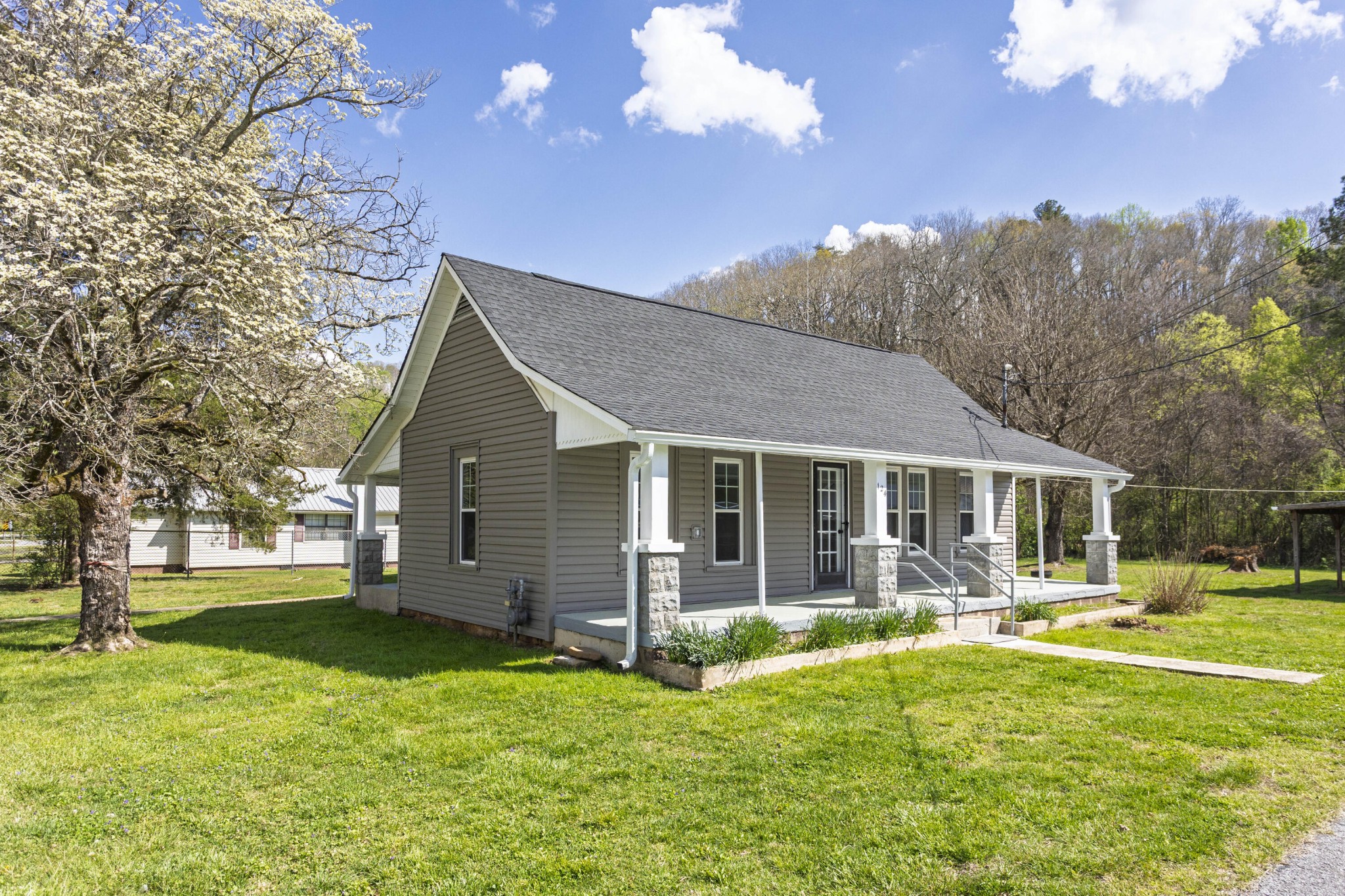 a view of a house with a backyard