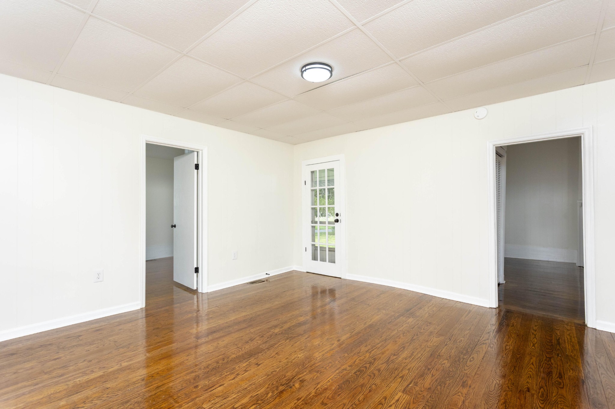 124 Gothard Road Sale Creek, TN 37373 - Photo 11 of 56 a view of an empty room with wooden floor and a window