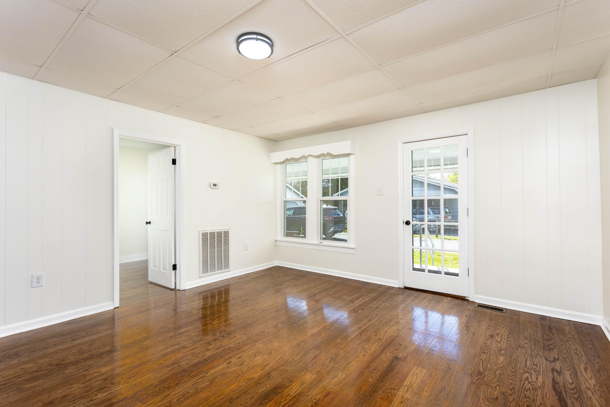 124 Gothard Road Sale Creek, TN 37373 - Photo 12 of 56 an empty room with wooden floor and windows