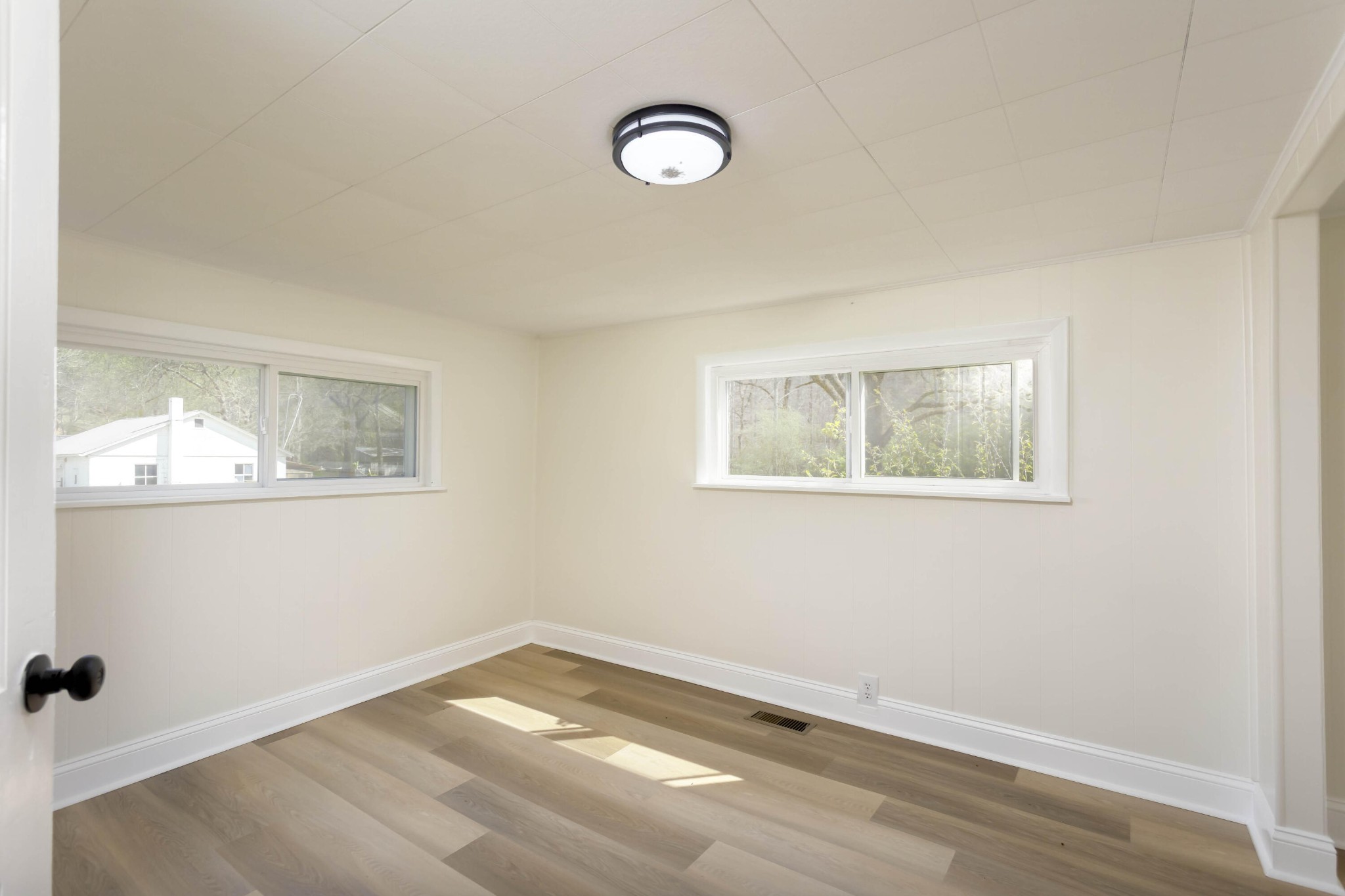 124 Gothard Road Sale Creek, TN 37373 - Photo 21 of 56 a view of empty room with wooden floor and fan