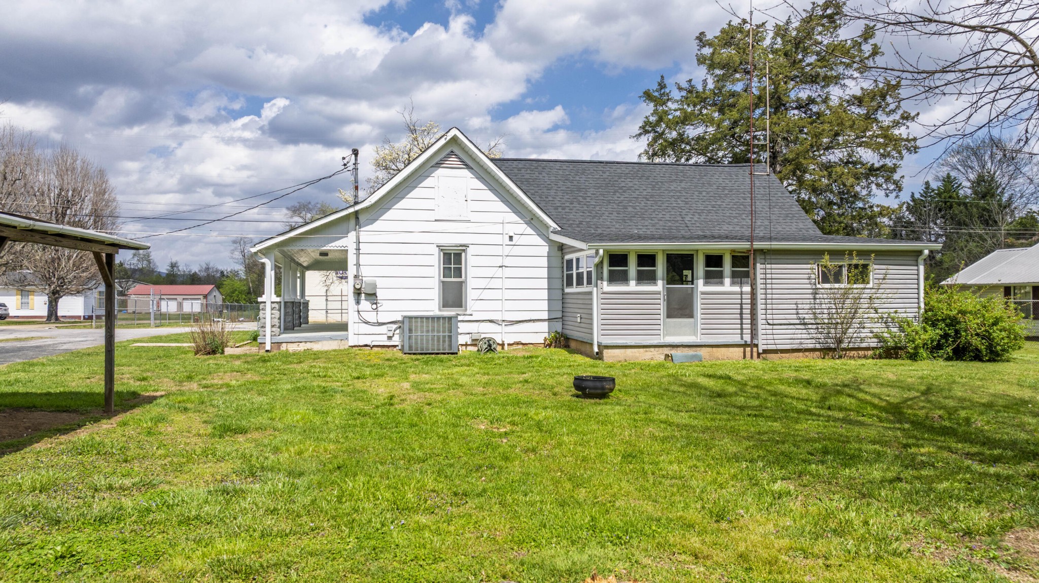 124 Gothard Road Sale Creek, TN 37373 - Photo 28 of 56 a backyard of a house with table and chairs