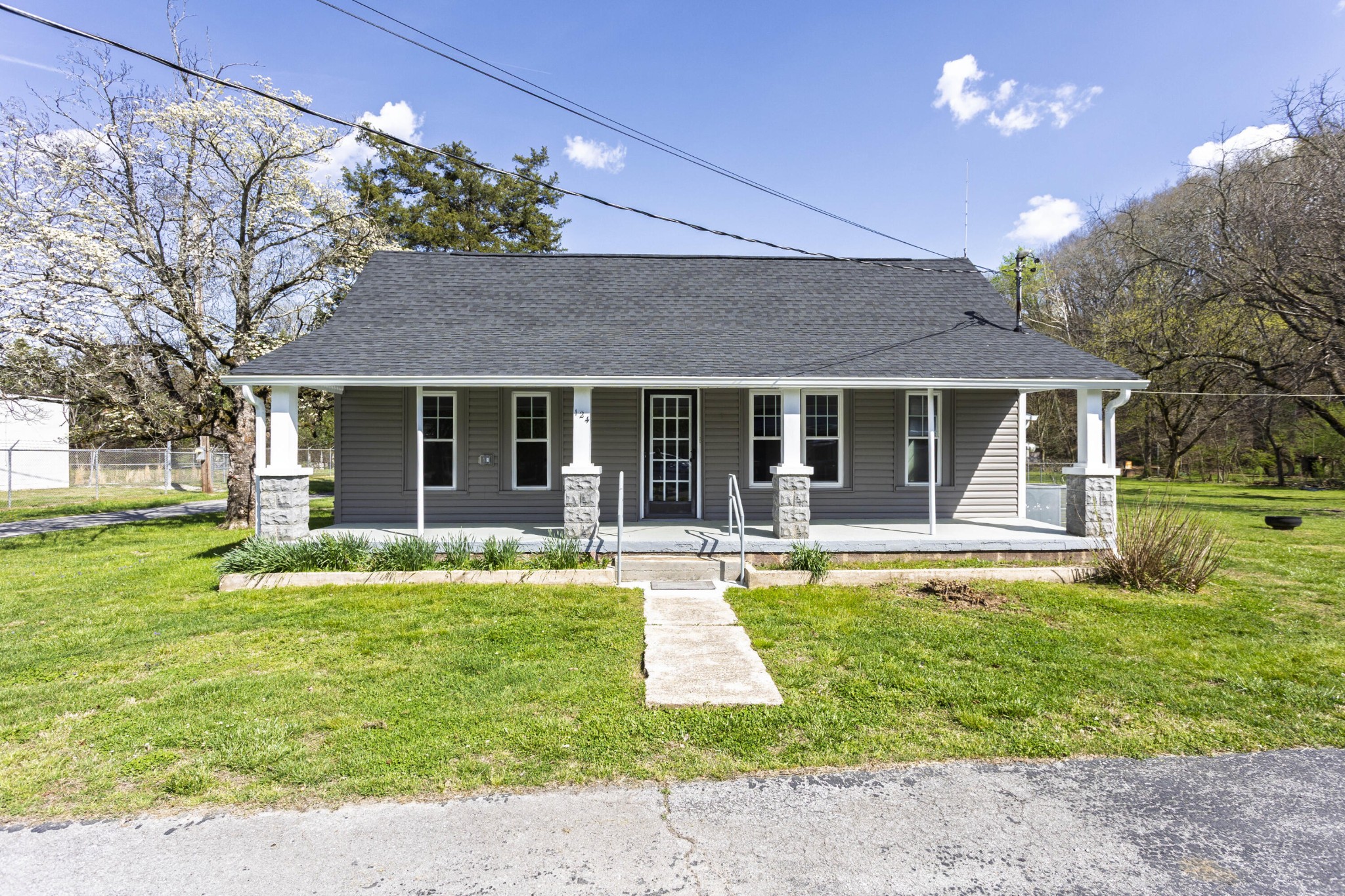 124 Gothard Road Sale Creek, TN 37373 - Photo 30 of 56 a view of a house with swimming pool and a yard