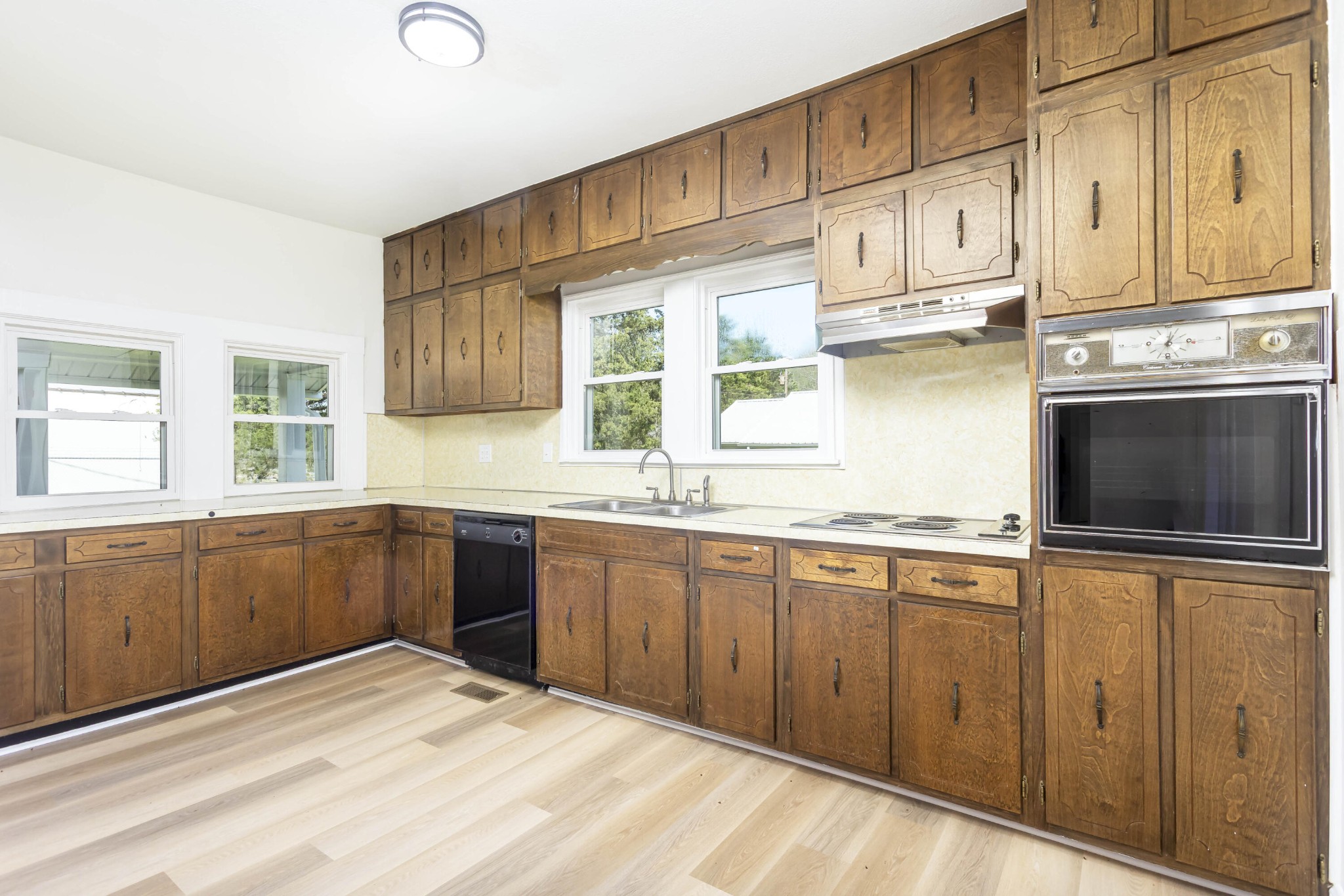 124 Gothard Road Sale Creek, TN 37373 - Photo 3 of 56 a kitchen with stainless steel appliances granite countertop a stove a sink and a microwave