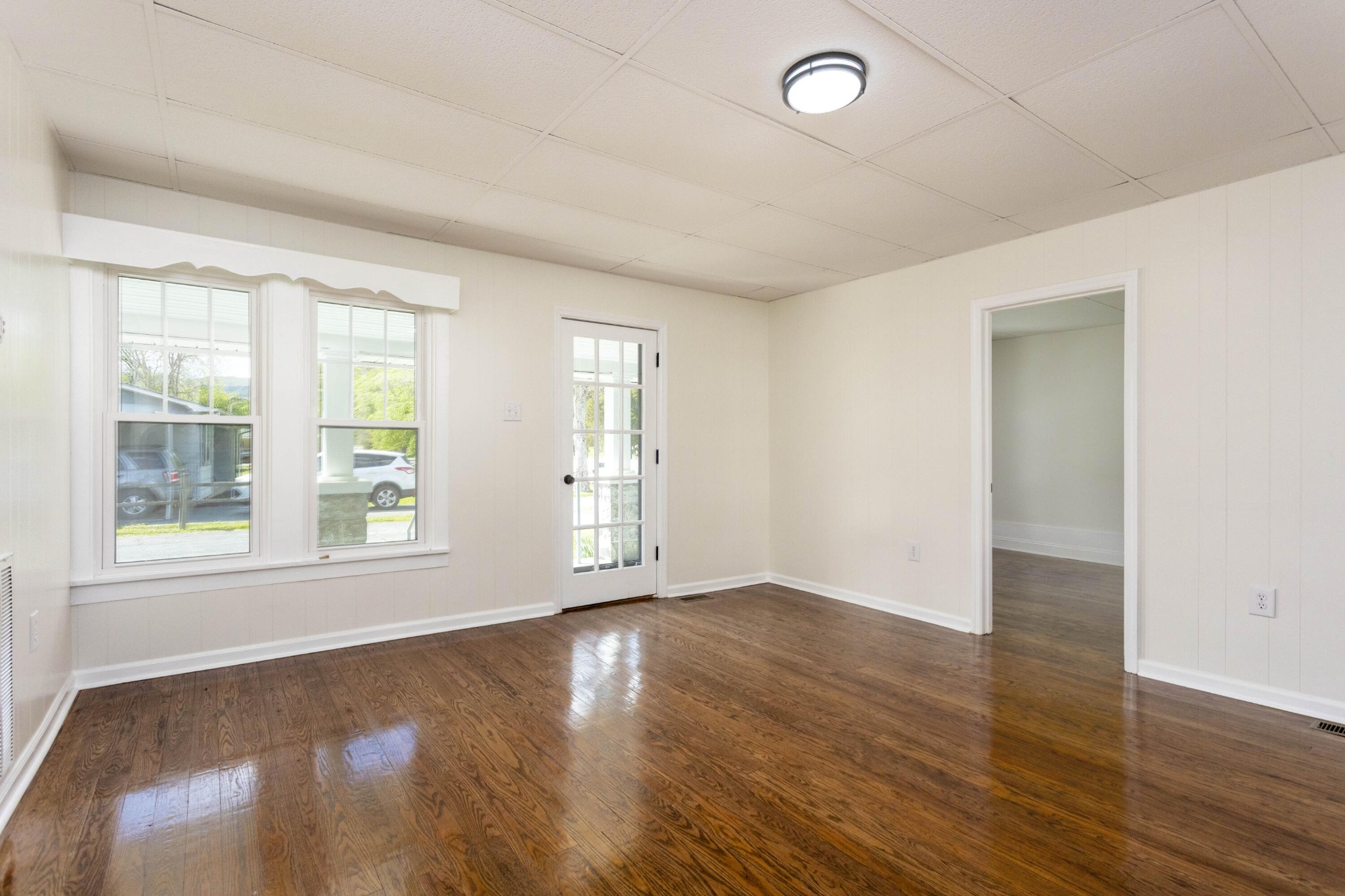 124 Gothard Road Sale Creek, TN 37373 - Photo 4 of 56 an empty room with wooden floor and windows