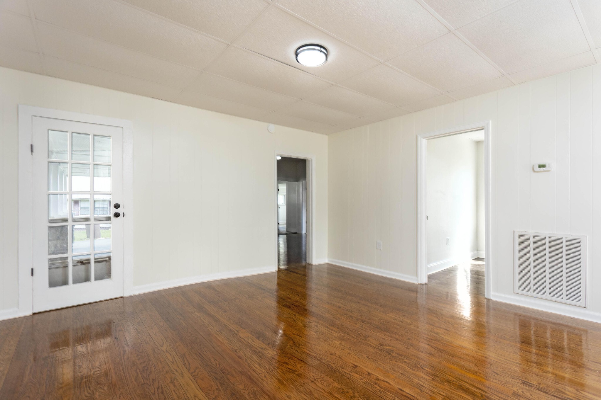 124 Gothard Road Sale Creek, TN 37373 - Photo 10 of 56 a view of an empty room with wooden floor and a window