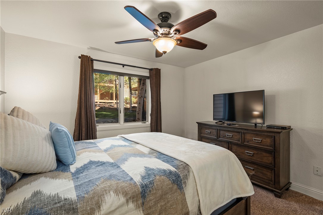 939 Incline Way, Unit 200 Incline Village, NV 89451 - Photo 14 of 27 a bedroom with a bed and a flat screen tv