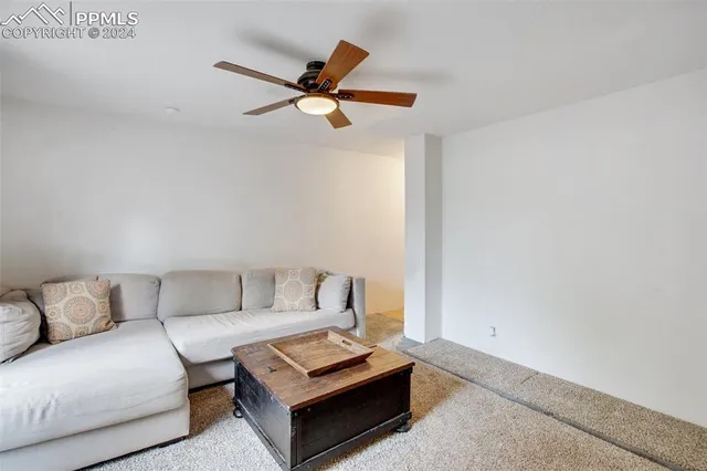a living room with furniture and a rug