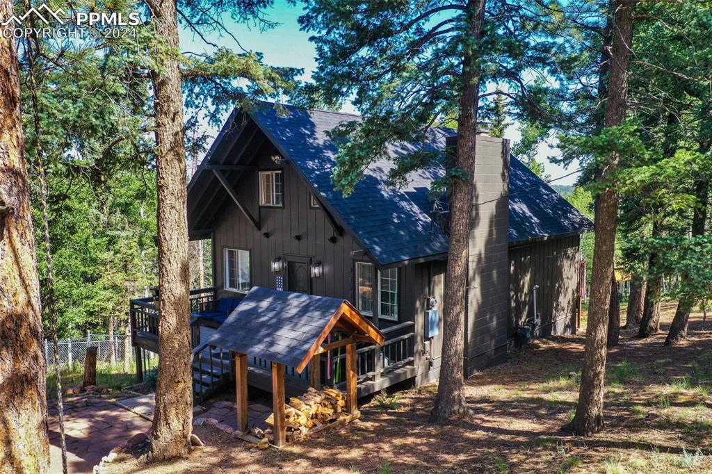 377 Ridge Road Divide, CO 80814 - Photo 6 of 50 a front view of a house with a yard