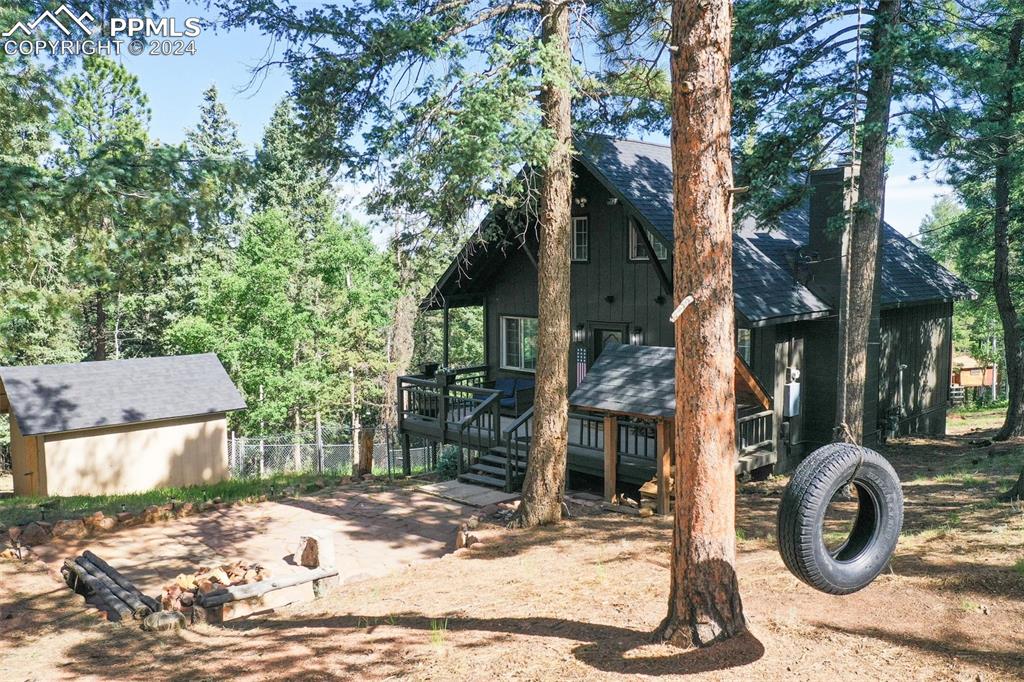 377 Ridge Road Divide, CO 80814 - Photo 9 of 50 a front view of a house with garden