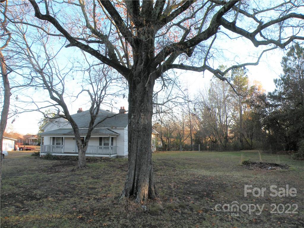 1423 Gold Hill Road, Unit 1 Fort Mill, SC 29708 - Photo 18 of 20 a view of a trees and barn in the middle of a yard
