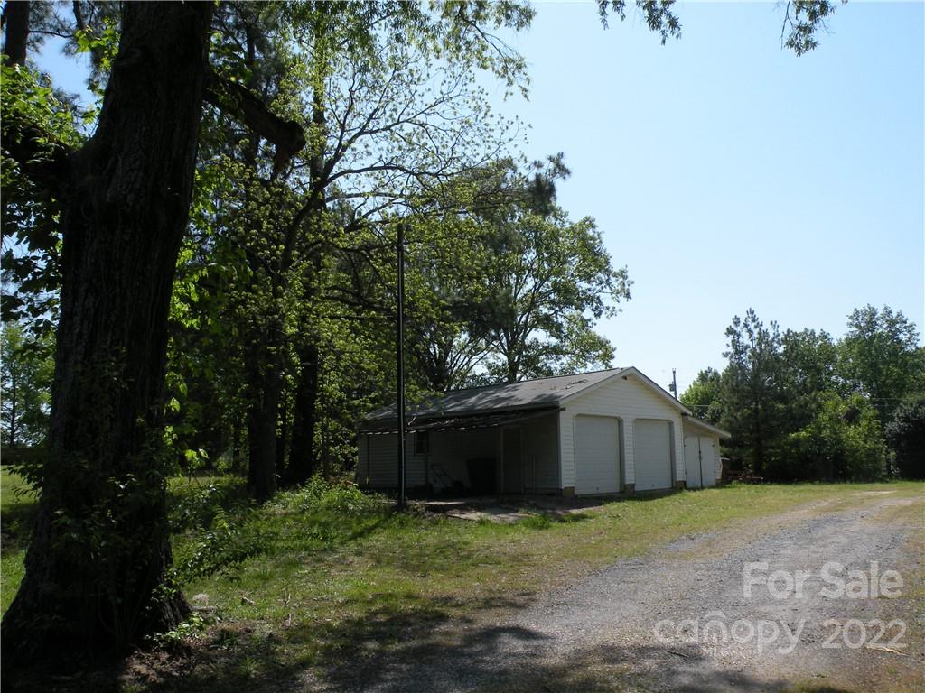 1423 Gold Hill Road, Unit 1 Fort Mill, SC 29708 - Photo 7 of 20 a wooden house with tall trees