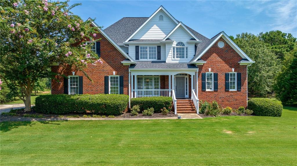 1040 Arborwood Ridge Bishop, GA 30621 - Photo 1 of 1 a front view of a house with a yard