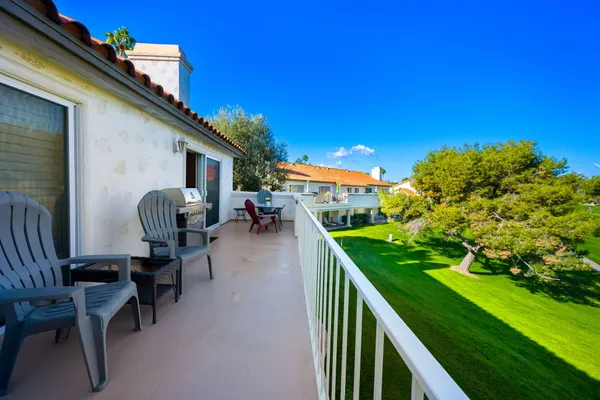 a patio with table and chairs