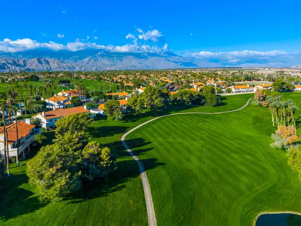 a view of a golf course with a lake
